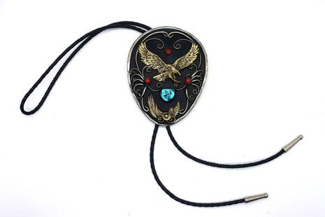 Large Vintage Circa 1930 Bolo Tie: Large Vintage circa 1930 bolo tie German Silver Navajo L 4 1/4" x 3 1/4 " W. Large brass eagle & feather cluster, (1) Kingman Turquoise stone 1/2" diameter, (3) round Mediterranean coral 5 mm, German