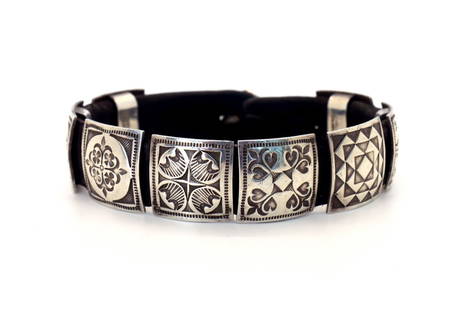 Vintage Navajo Michael Montano SS Concho Bracelet: Vintage circa 1980 award winning Navajo Michael Montano sterling silver concho bracelet with (8) hand-stamped and hand-tooled conchos measuring L 3/4" x 3/4" W and (1) handmade, stamped button 1/2" ro