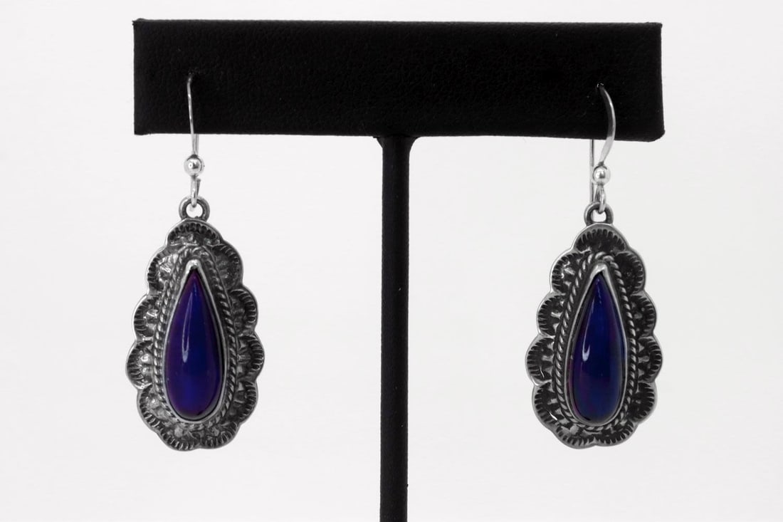 Navajo Kevin Ramone Sterling Silver Lapis Earrings: Native American Navajo artist Kevin Ramone sterling silver AAAA Afghanistan Lapis earrings. The single tear drop gemstone is L3/4" x 1/4"W. Earrings are bezel set with twisted wire and a hand tooled s