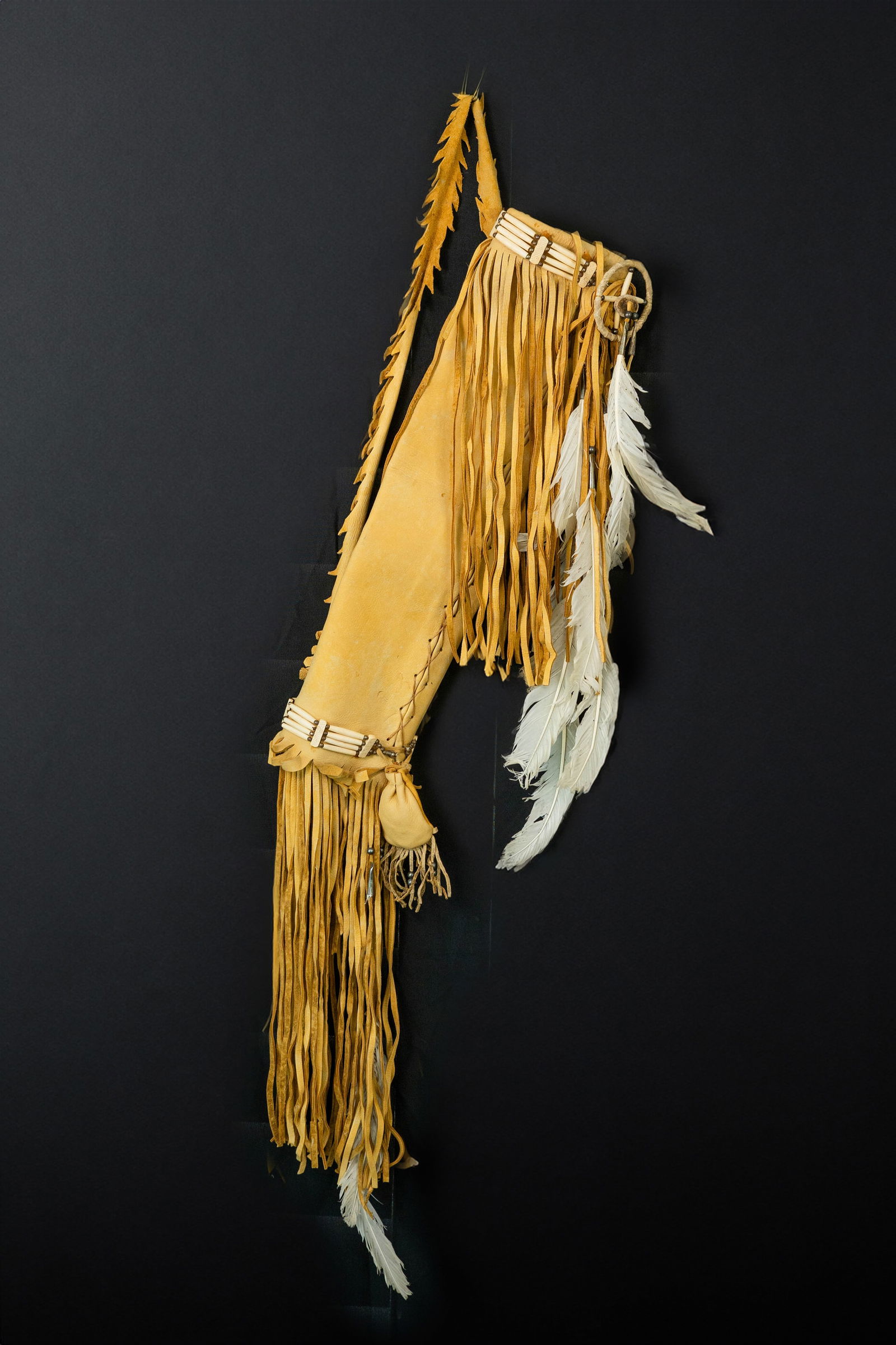 Vintage Sioux Leather Arrow Quiver: Native American Sioux Vintage Deerskin arrow quiver hand sewn. Accentuated with dream catcher bone beads silver beads and feathers it has leather fringe both top and bottom it has shoulder strap of 34