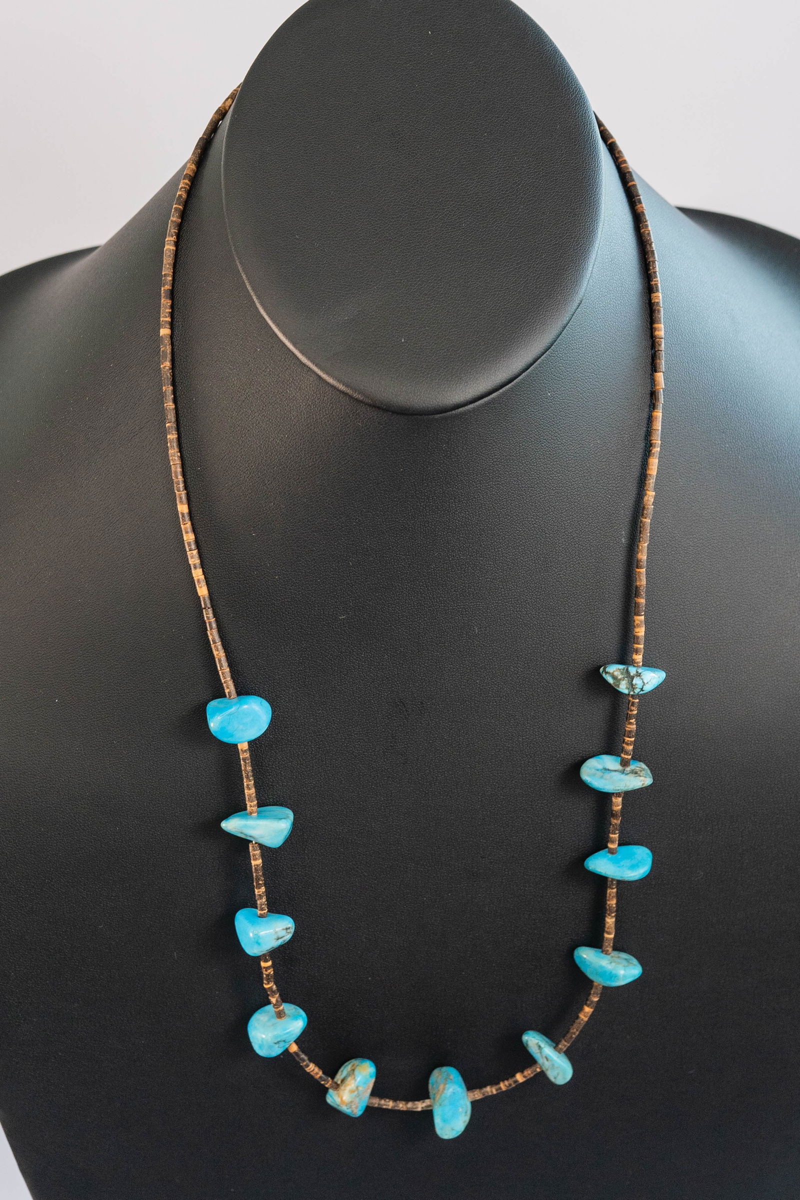 Vintage Rare Red Mountain Turquoise: Native American Navajo vintage shell heishi necklace with (11) rare Red Mountain Turquoise polished nuggets with (4) sterling silver Navajo Pearls. OAL 28".