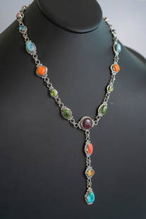 Captivating Betty Tom Multi-Gemstone Necklace: Native American Navajo master silversmith Betty Tom captivating sterling silver multi stone necklace featuring Amethyst, Pink Conch Shell, Blue Topaz, Golden Hills Turquoise, Red, Orange and Purple Sp