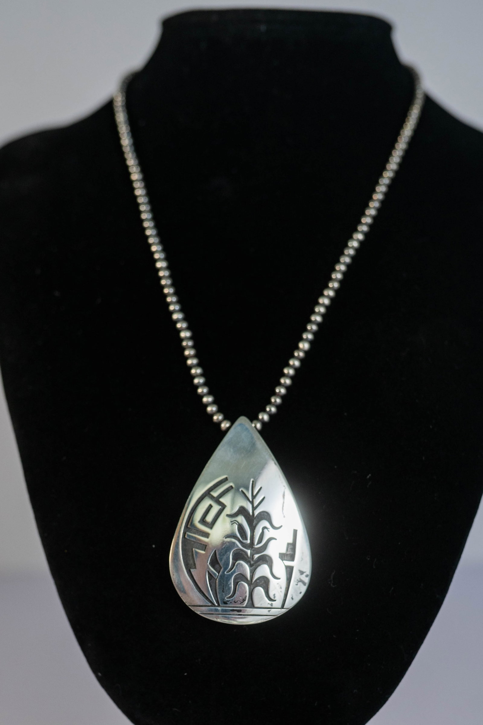 Hopi Vintage Pendant Necklace: Native American Hopi artist Wilmer Saufike vintage sterling silver pendant with traditional corn stalk design on sterling silver 3mm 16 inch Navajo pearls with 2 inch extender. Pendant L 2" x 1 1/4" W