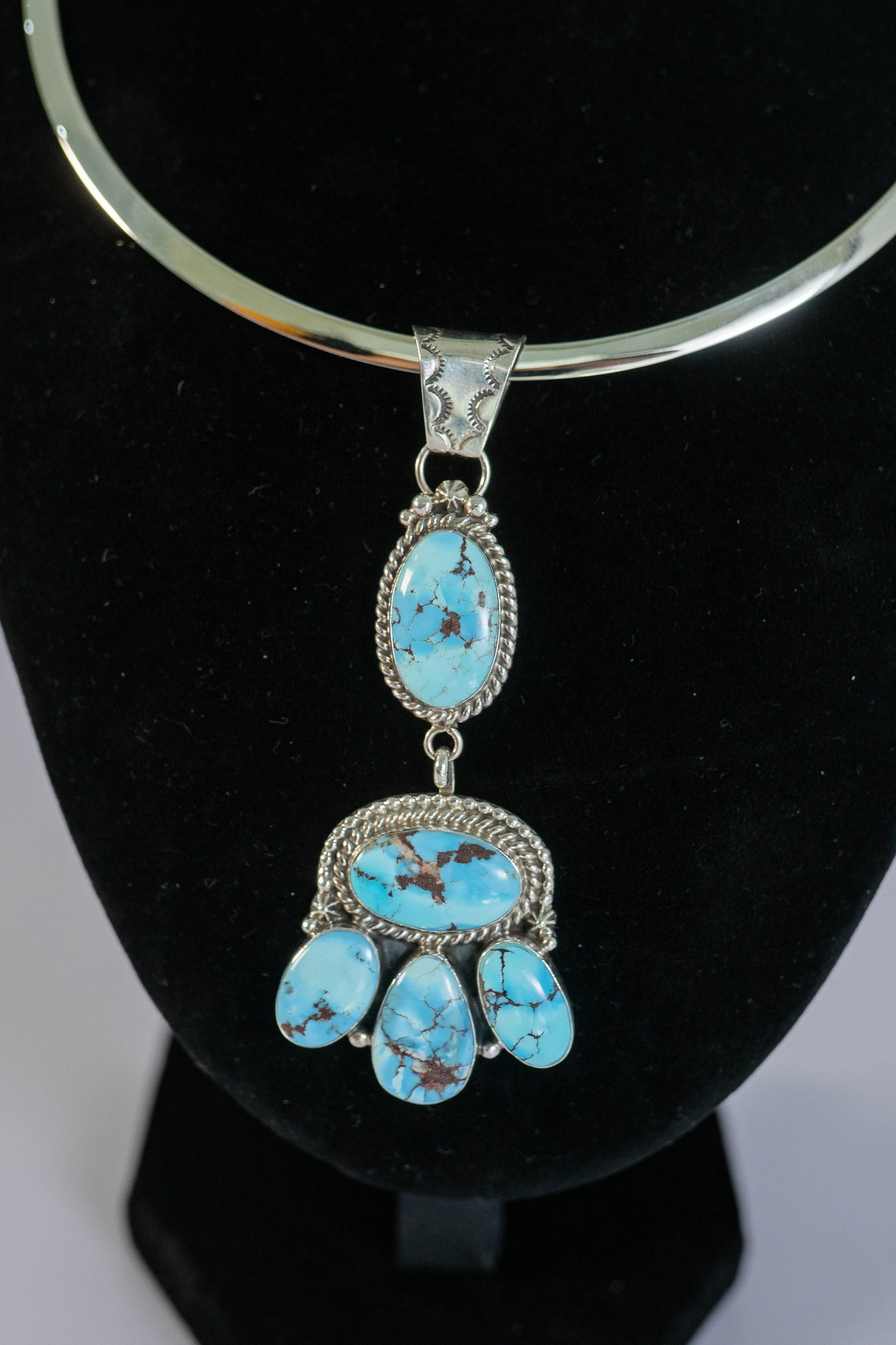 Extraordinary Golden Hills Turquoise Pendant: Native American Navajo Master Silversmith Lee Brown extraordinary sterling silver pendant featuring AAAAA Golden Hills Turquoise gemstones surrounded by twisted wire with dot spacer beads and star and