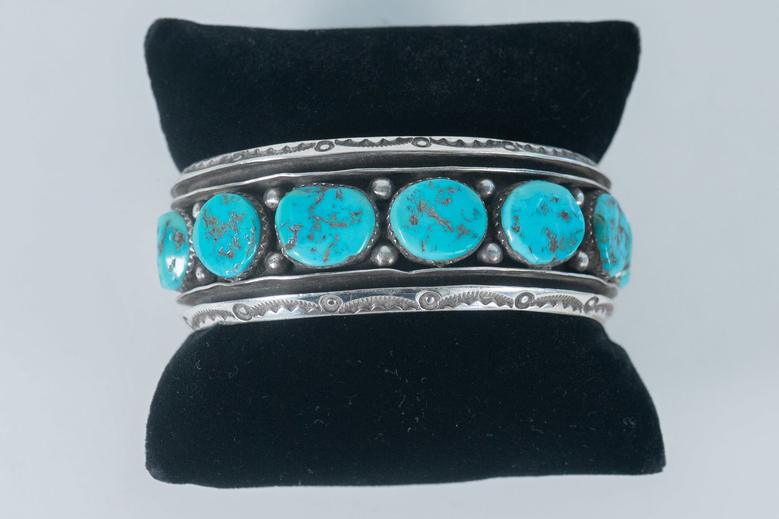 Master Silversmith Ben Touchine Kingman Cuff: Native American Navajo master silversmith Ben Touchine, known for his strong hand carved cuffs, as shown here with this Vintage sterling silver cuff bracelet featuring (7) AAAA Kingman Turquoise gemst