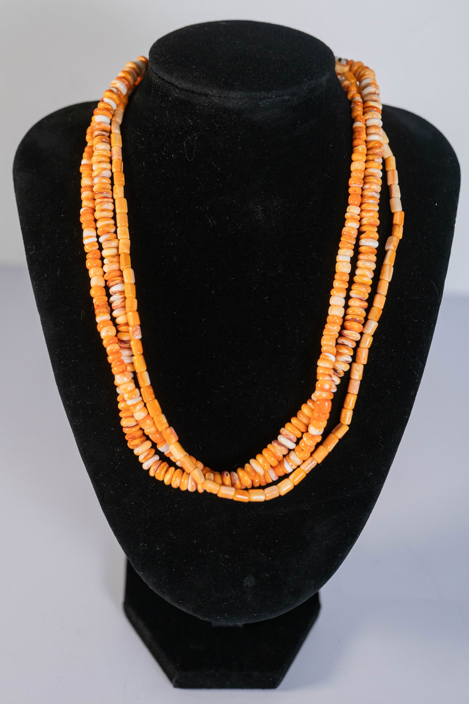 Orange Spiny Oyster Shell Three Strand Necklace: Native American Navajo three strand necklace featuring AAAA Orange Spiny Oyster Shell heishi and rondelle gemstones with sterling silver end caps and findings. 16" long with a 1 1/2" extender.