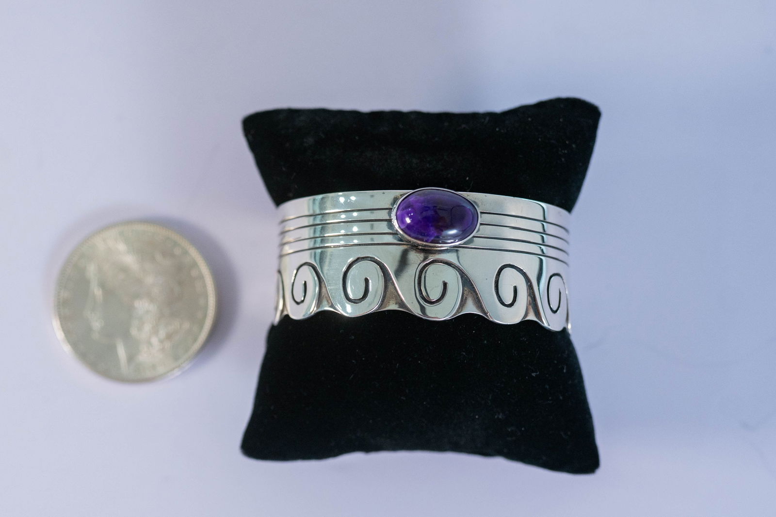 Unique Amethyst Wave Cuff: Native American Navajo master silversmith L. Juan unique sterling silver cuff bracelet featuring a wave design and a AAAAA Amethyst oval gemstone. Size 8 W 1" Gap 1". Signed L. Juan.