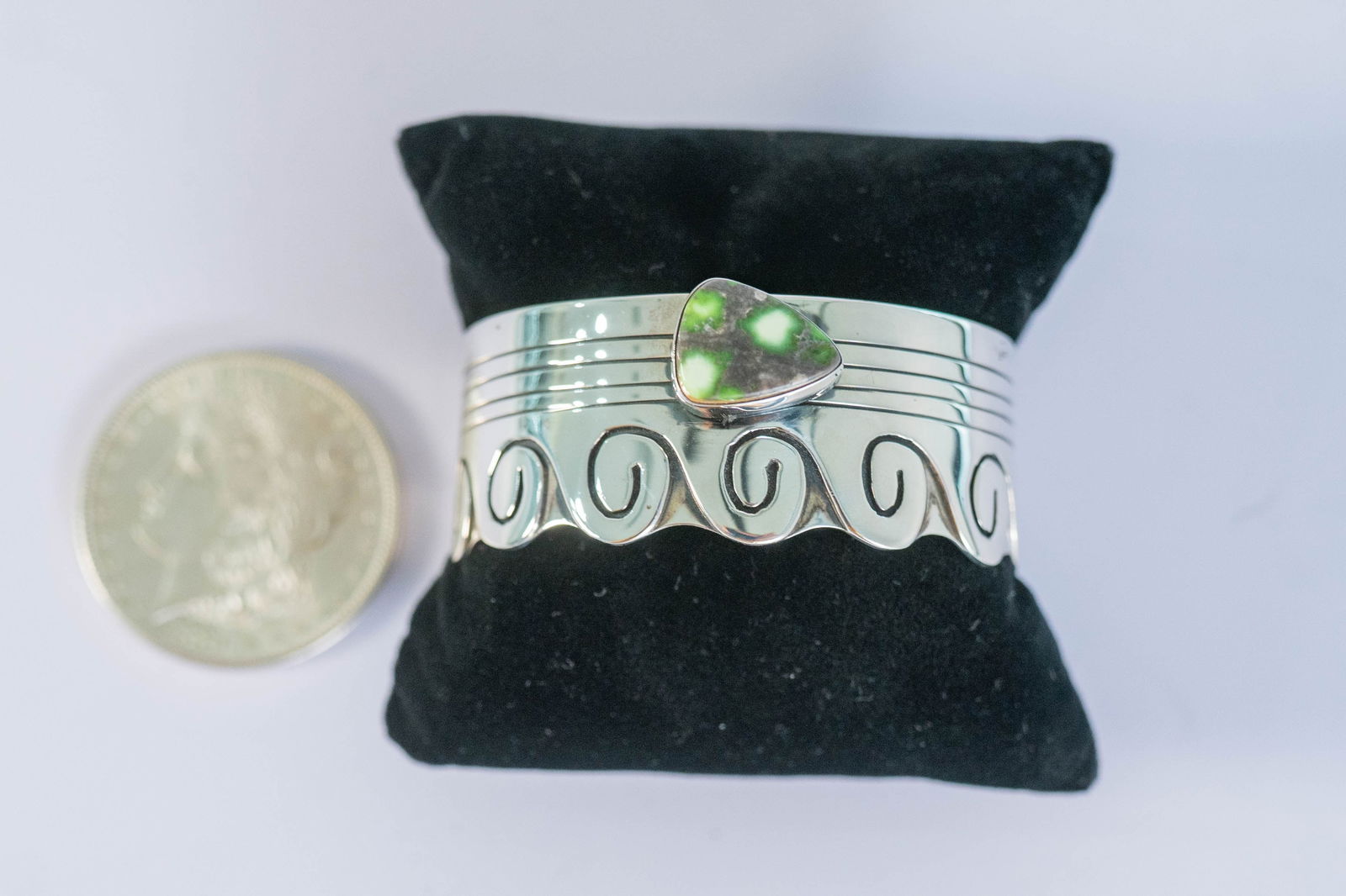 Unique Carico Lake Turquoise Wave Cuff: Native American Navajo master silversmith L. Juan unique sterling silver cuff bracelet featuring a rare AAAAA Carico Lake gemstone and a wave design. Size 7 W 1" Gap 1 1/4" Signed J. Juan