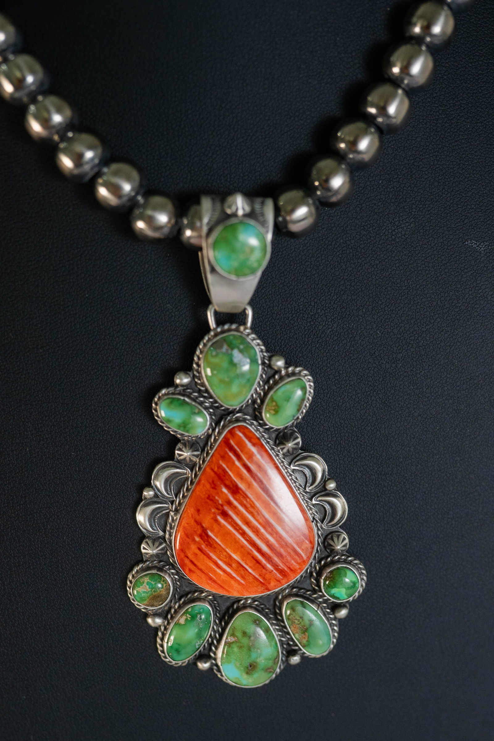 Sheila Tso Fantastic Pendant Necklace: Native American Navajo Master silversmith Sheila Tso fantastic sterling silver pendant featuring AAAAA red spiny oyster shell center stone large 1 1/2" L X 1 1/8" W surrounded by twisted wire and (