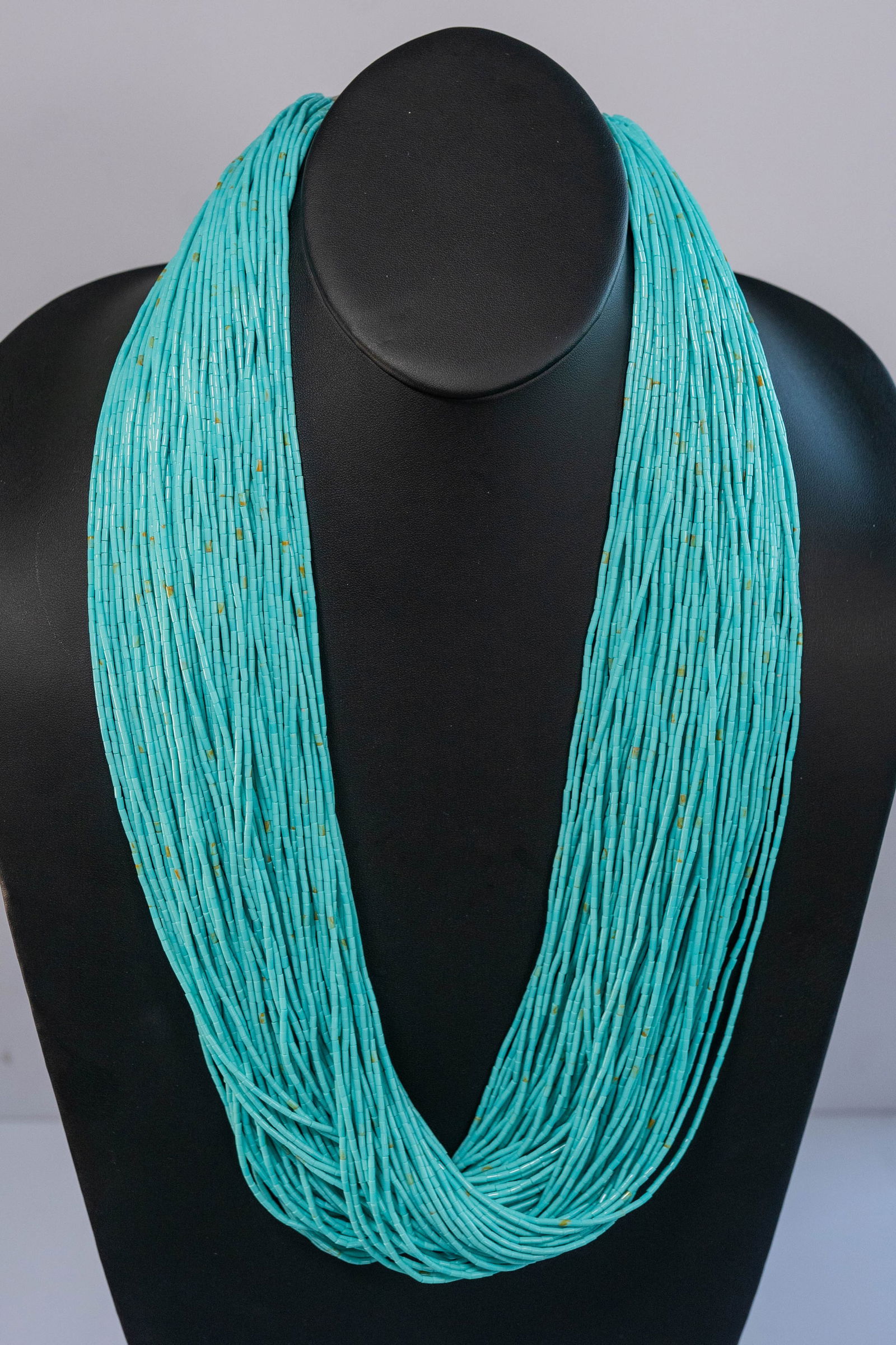 Kingman Turquoise Heishi 100 Strand Necklace: Native American Navajo Kingman Turquoise Heishi 100 strand 30" long necklace with sterling silver cones and findings.This is a major statement piece!