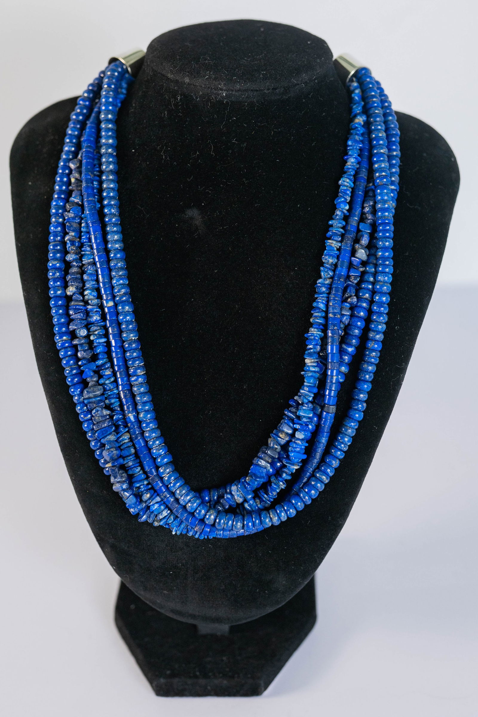 Marvelous Five Strand Lapis Necklace: Native American Navajo marvelous five strand necklace featuring AAAAA Afghanistan lapis Rondell heishi and Chip gemstones with gold matrix. Finished with sterling silver in caps and hand tool chain li