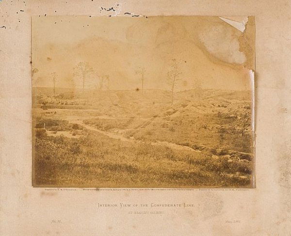 Albumen of "Gracie's Salient".: Interior view of the Confederate lines at Petersburg, May 1865. Photographed by Alexander Gardner (1821-1882). The image has pulled away from the mounting board in a few places and has slight damage i