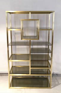 Polished Brass Vitrine with Tinted Glass Shelves: ++++ WE OFFER COMPETITIVELY PRICED WORLDWIDE SHIPPING WITH AN EXTERNAL PARTNER.++++ Polished brass shelving structure with tinted glass shelves attributed to Romeo Rega, circa 1970. Brass in great res