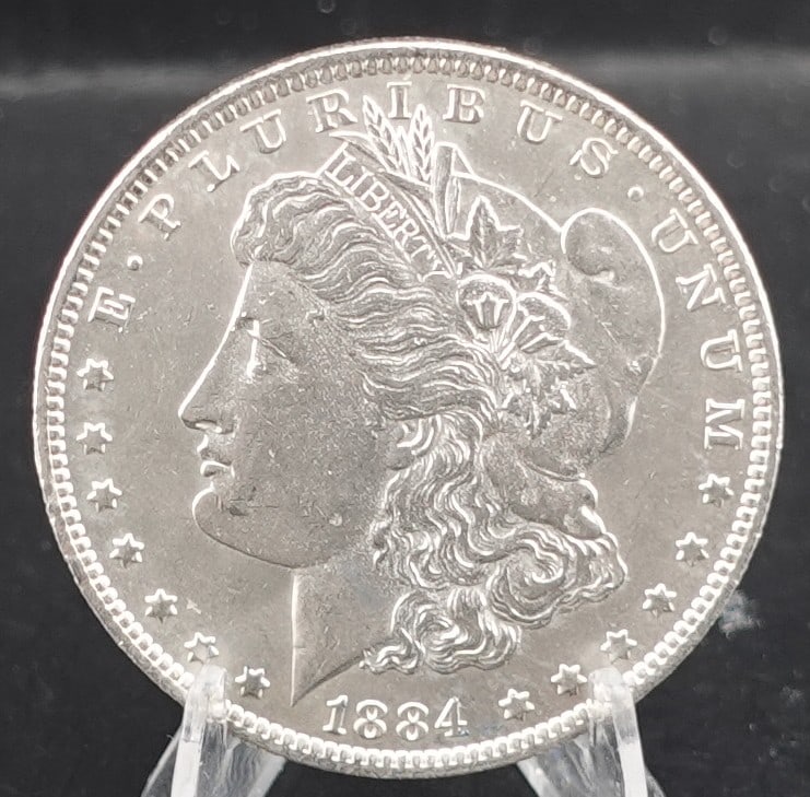 1884-O Morgan Dollar: This is a High Grade Coin. Full Breast Feathers Low Estimate: 50.00 High Estimate: 70.00
