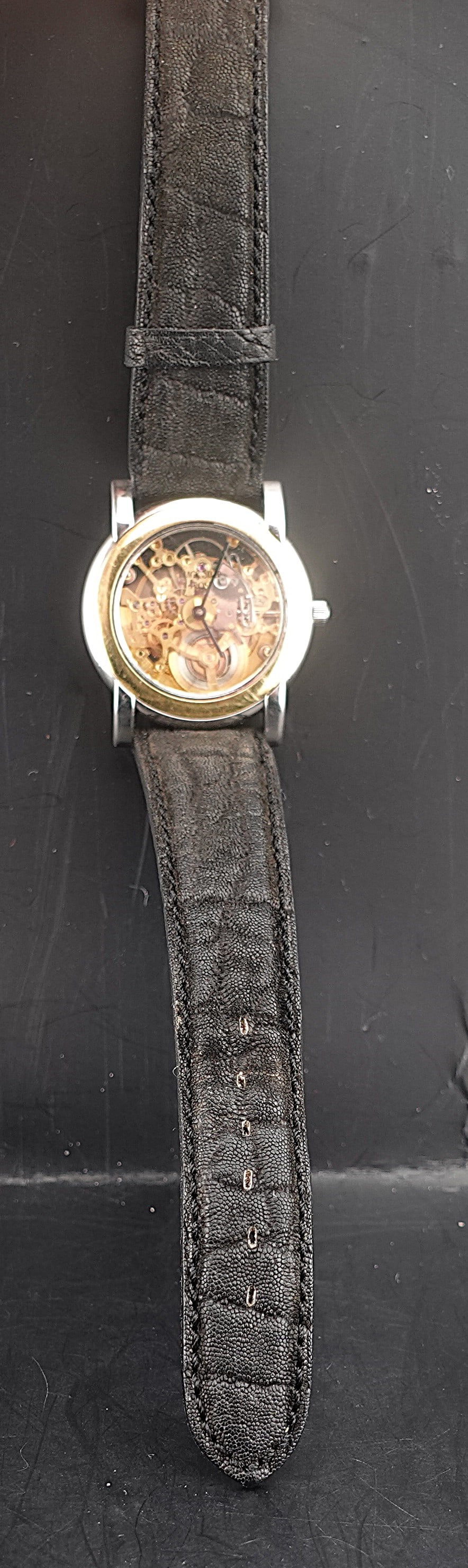 Alexis Barthelay Men's Watch: Vintage and rare. Alexis Barthelay for Black Star and Frost - stainless steel and gilt automatic skeletonized wristwatch, the gilt-finished skeletonized jeweled movement visible between the glazed fro