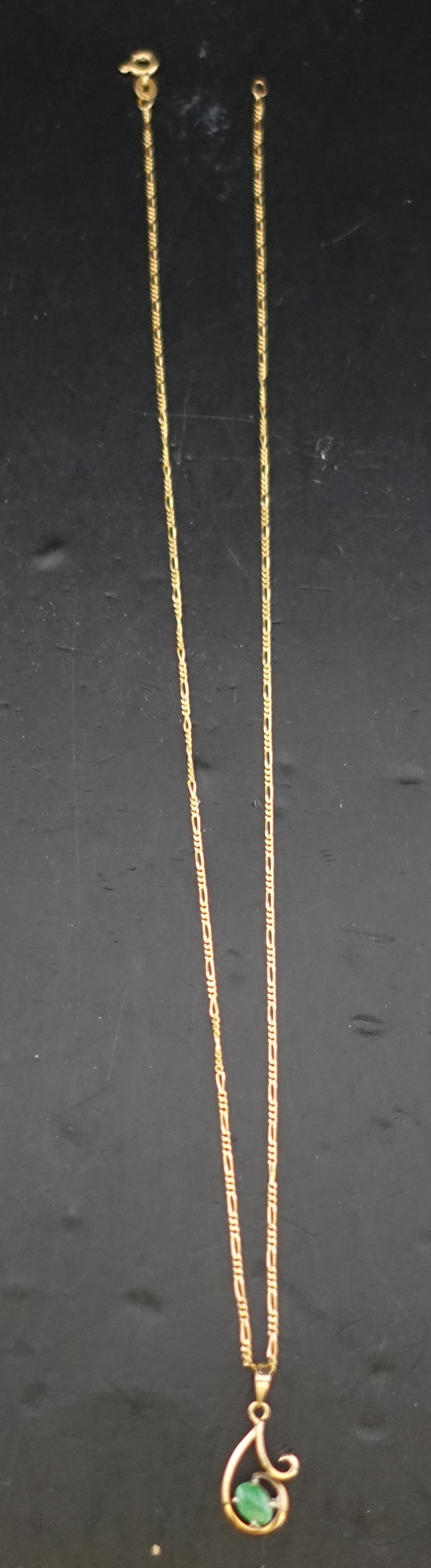 17 3/4' 14K Gold Necklace and Emerald Pendant: Weight is 2.78g approx. size of the emerald is .75 Carats Low Estimate: 180.00 High Estimate: 220.00