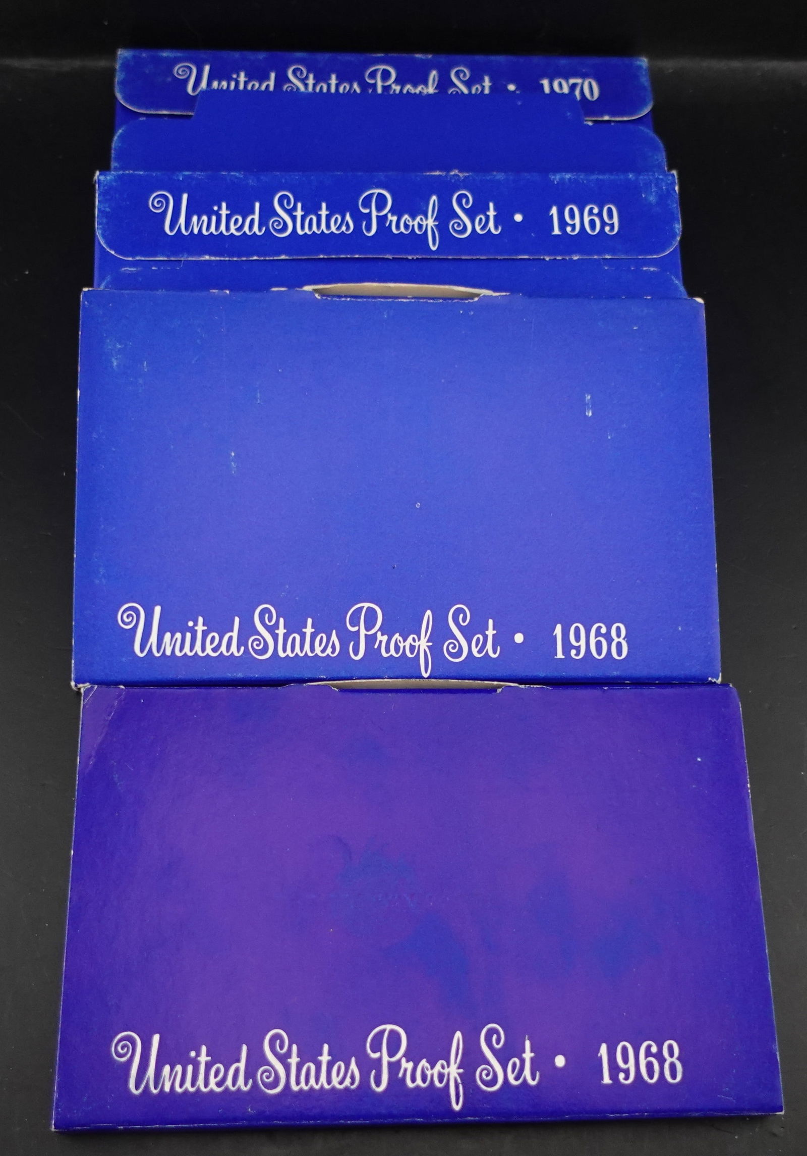 (4) US Mint Proof Sets: These have the 40% Silver Kennedy Half Dollar! These appear to be cameo. Low Estimate: 50High Estimate: 70