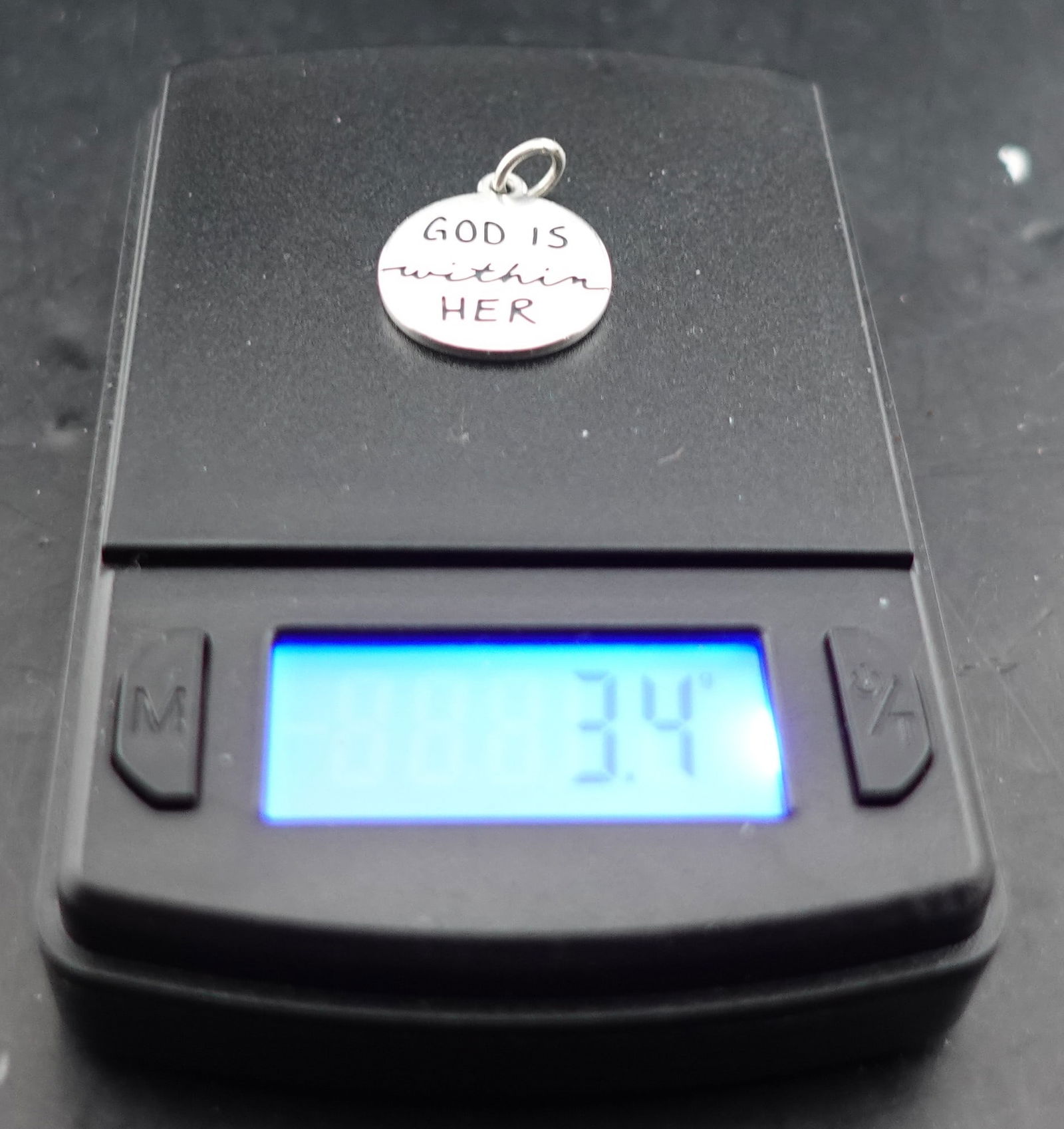 James Avery Silver God is with Her Charm: This is sterling silver and weighs 3.4g Condition: ExcellentLow Estimate: 60.00High Estimate: 80.00