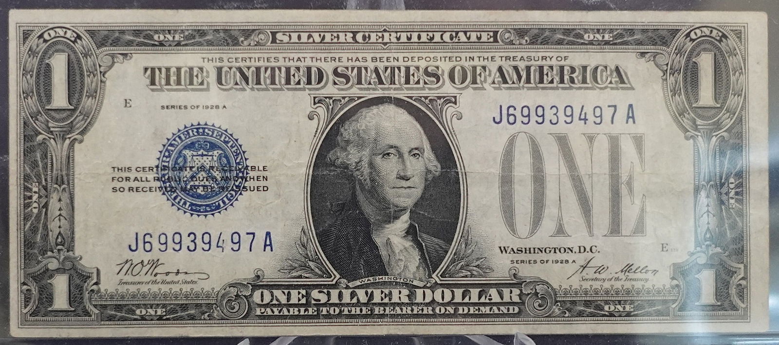 1928 A $1 Silver Certificate: This is a Funny Back Variety Low Estimate: 100.00 High Estimate: 150.00