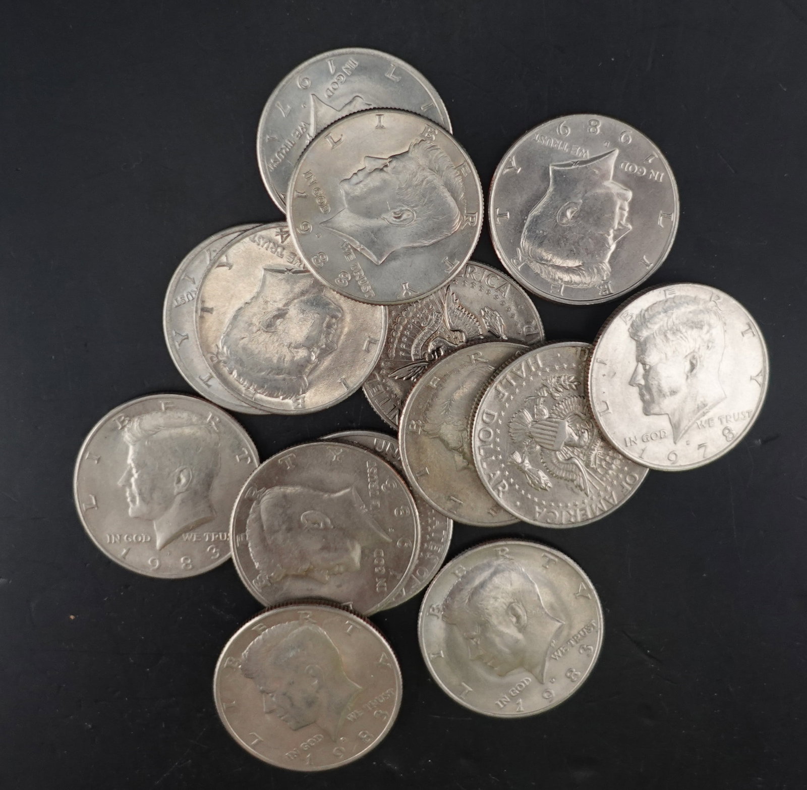 (14) Kennedy Half Dollars: Mixed Date and Mint Marks Low Estimate: 20.00 High Estimate: 30.00