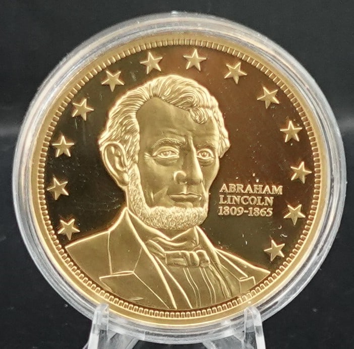 Abraham Lincoln Gold Coin: This is a 24k layered Commemorative Coin Low Estimate: 20.00 High Estimate: 30.00