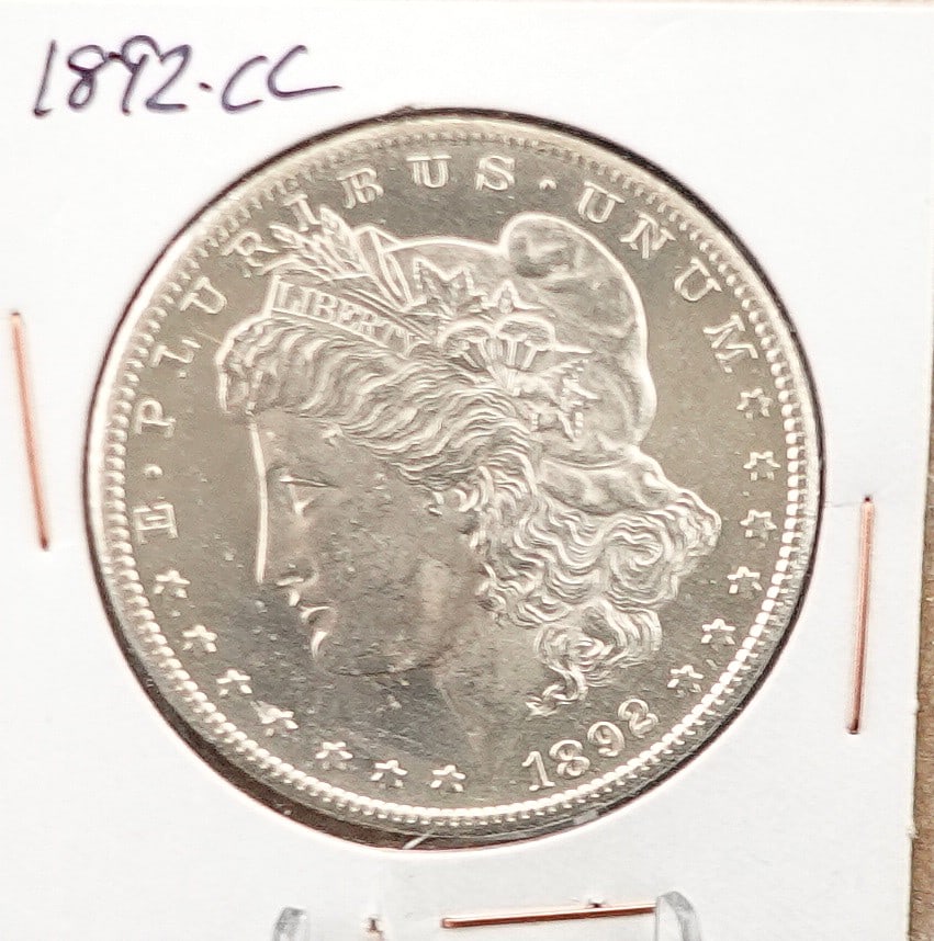 1892-CC Morgan Dollar: This is a High Grade Proof Like Coin! its like looing in a Mirror!! Low Estimate: 2200.00 High Estimate: 2500.00