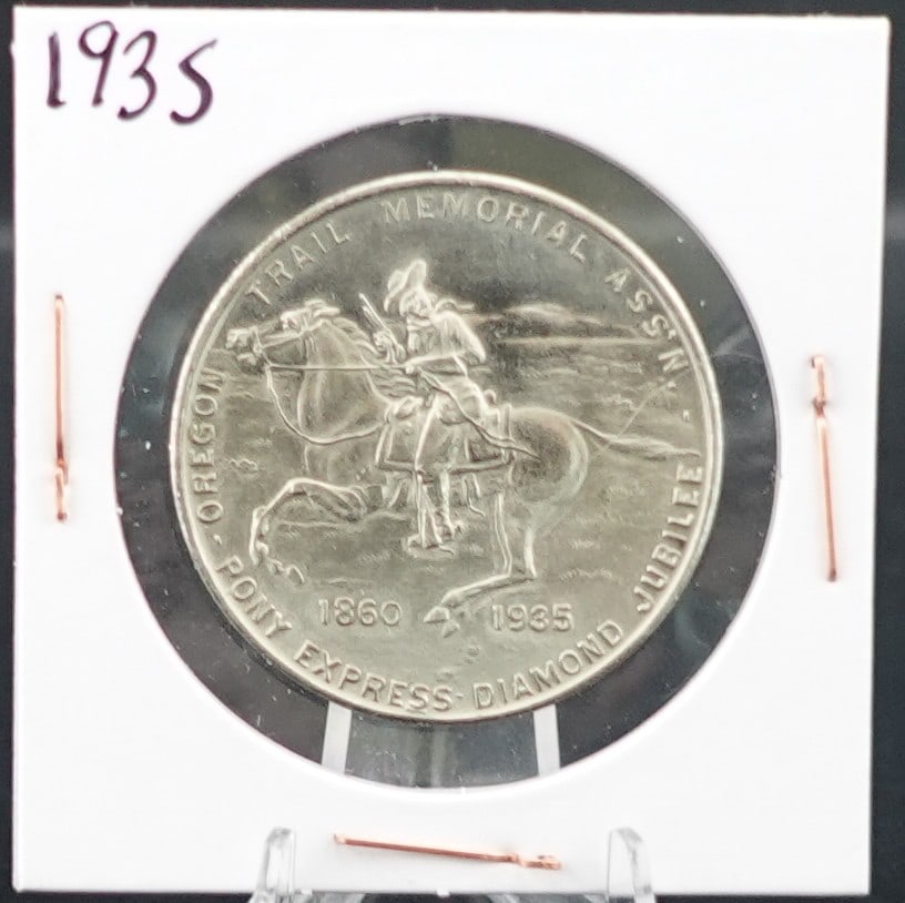 1935 Oregon Trail Memorial Jubilee Coin: This is a great coin! Included a Harras $1 Gaming Token Low Estimate: 50 High Estimate: 70