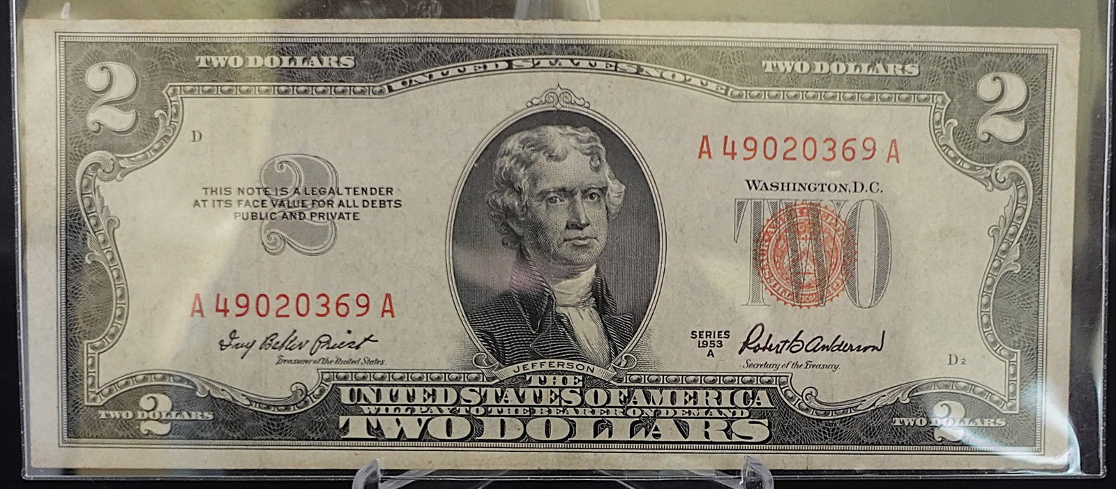 1953A Red Seal $2 Note: This is a Crisp Note! Low Estimate: 20.00 High Estimate: 30.00