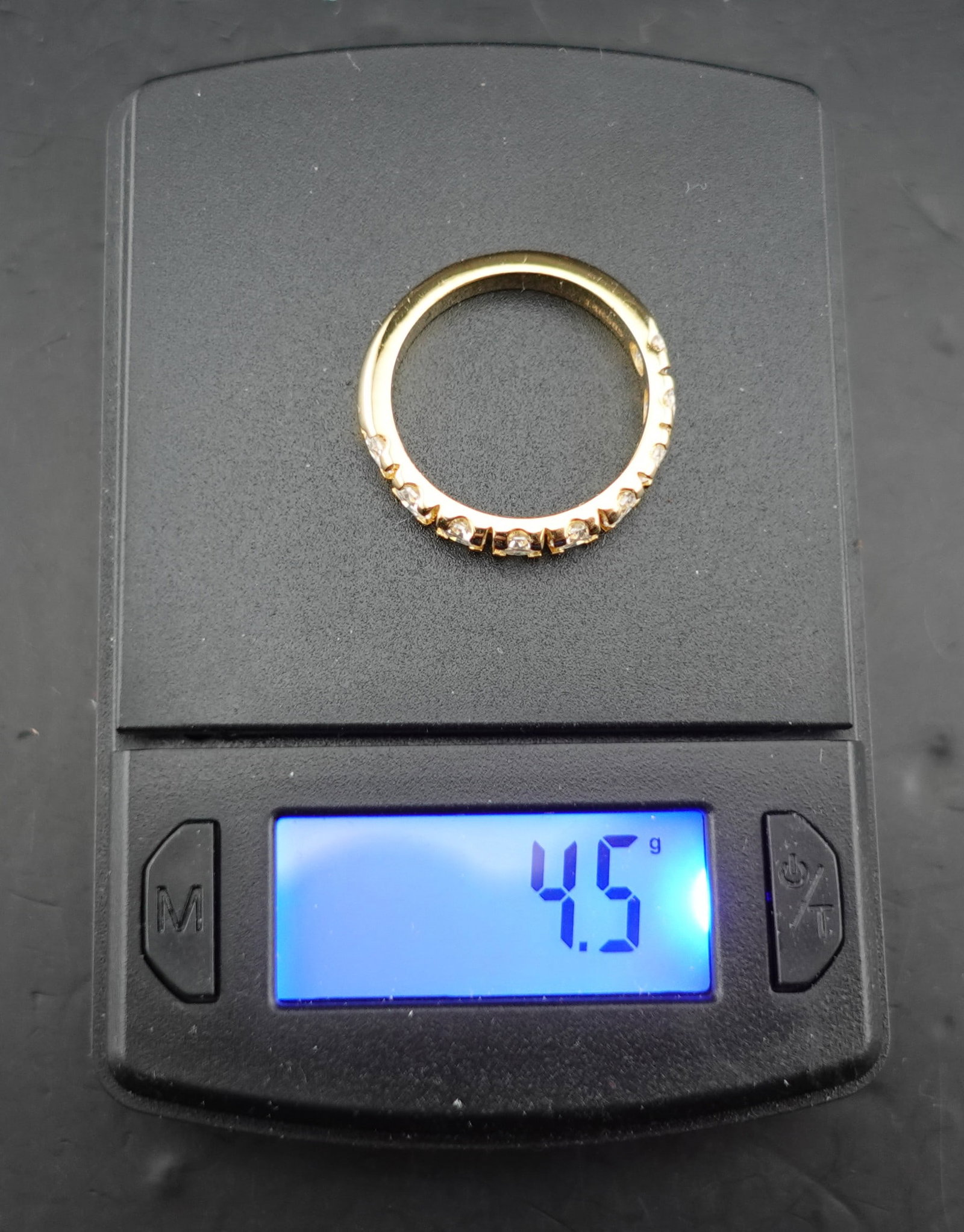 9 Moissanite set in 14k Gold size 9: All gems have been tested as was the gold. There is 4.5g of 14K gold. This is a Gorgeous Ring!