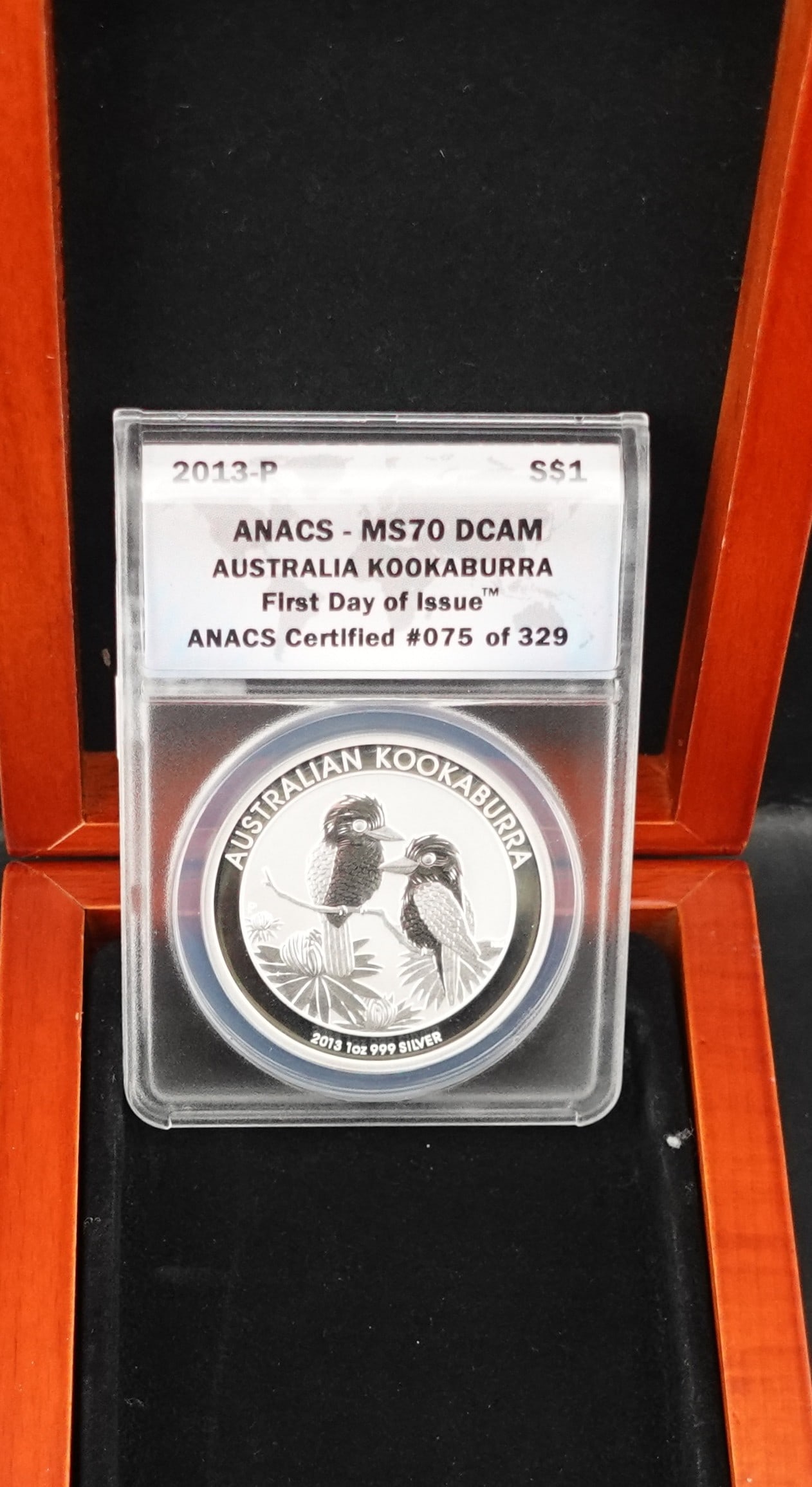 2013-P Australian Kookaburra Silver Coin: This is NGC Graded as First Day of Issue, numbered and Graded MS70 DCAM! Low Estimate: 200 High Estimate: 250