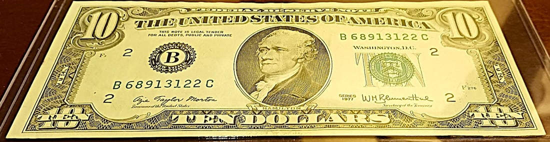 1977 $10 Note: This is an extremely hard note to find. The front has been printed on the back also! Great Details!!
