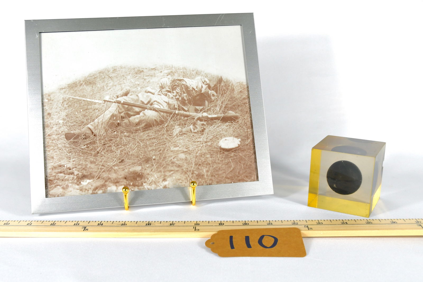 Grape Shot In Lucite With Modern Civil War Print: Photo depicts a badly maimed Civil War Soldier. Projectile is approximately 1.5", while lucite incasement is approximately 3" x 3"
