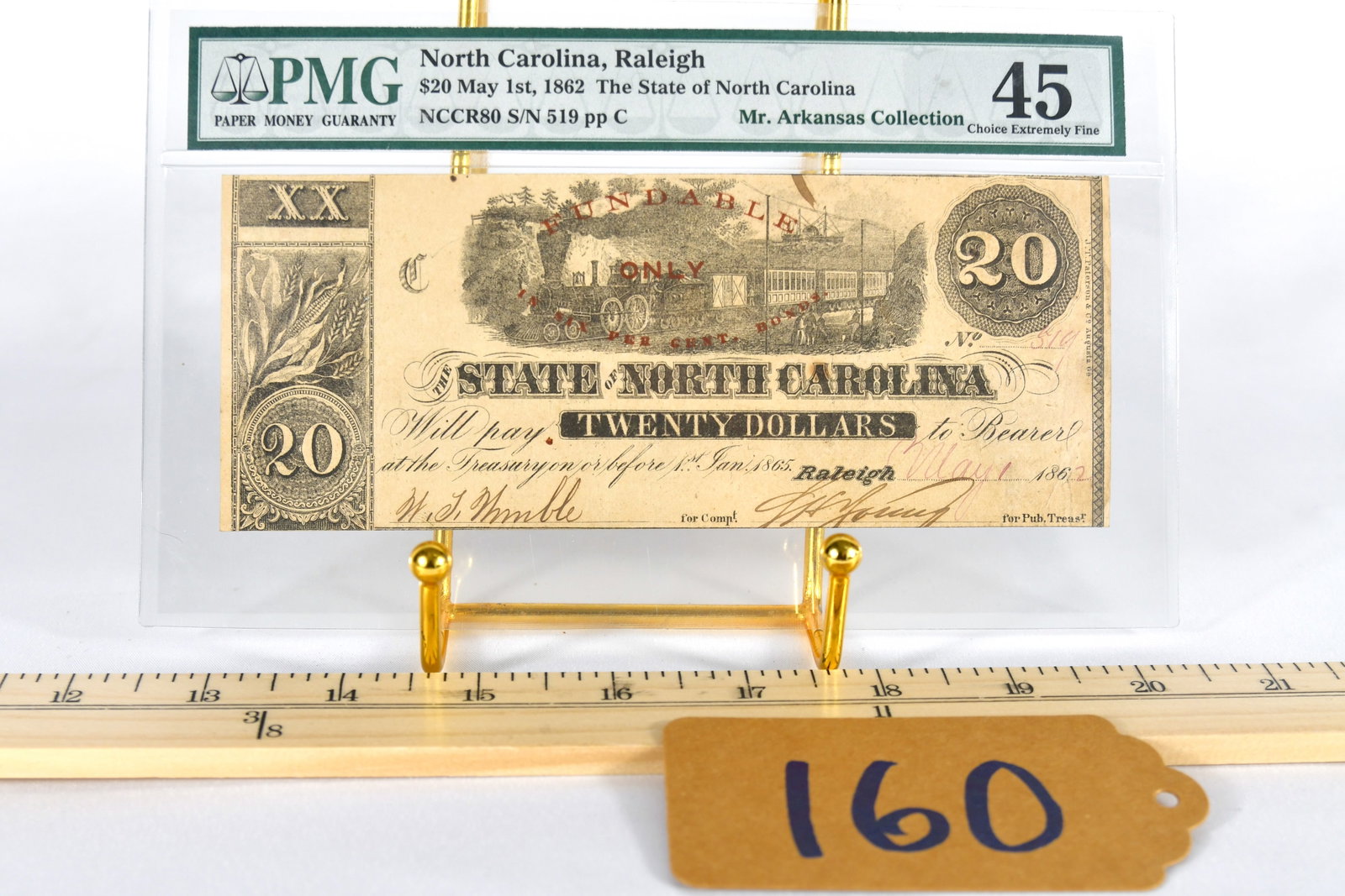 1862 Confederate $20.00 NC Bank Note (Ser. No. 519 Pp C): Confederate $20.00 Raleigh, NC Bank Note (Ser. No. 519 pp C) May 1st 1862 - "Pedigree - Mr. Arkansas Collection " PMG Certified - Certificate #1049643-008 NCCR8 S/N 519 pp C Graded Choice Extremely Fi