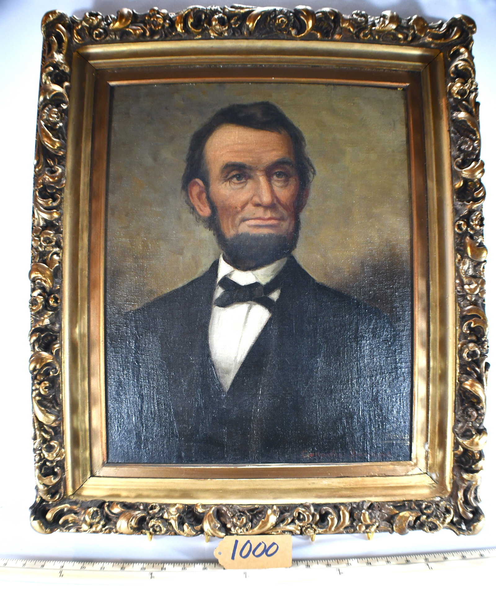 Painting Of Abe Lincoln: Framed by Cornelius Hawkin Antiqued Gold Frame Article from Northeastern News posted on back of painting. The frame measures 23.50 x 26.75 The painting measures 17.25 x 21.25 The painting has a signat