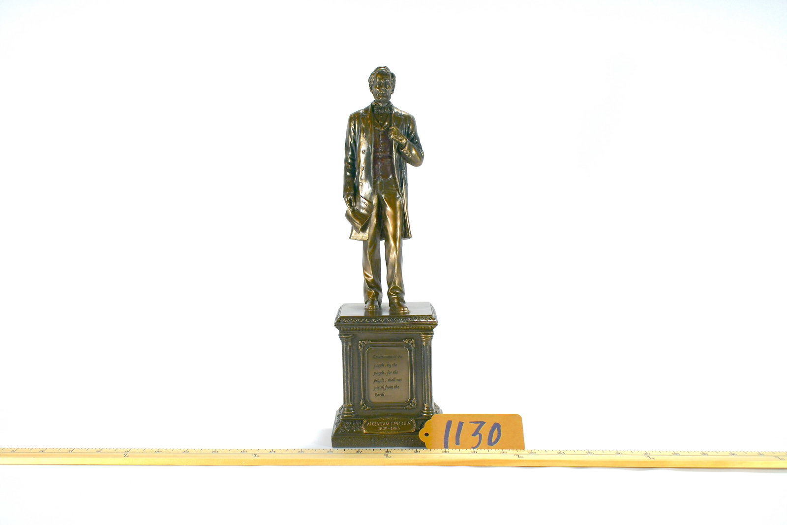 Abe Lincoln Statue: 14" tall with quotes written on base. Base is damaged