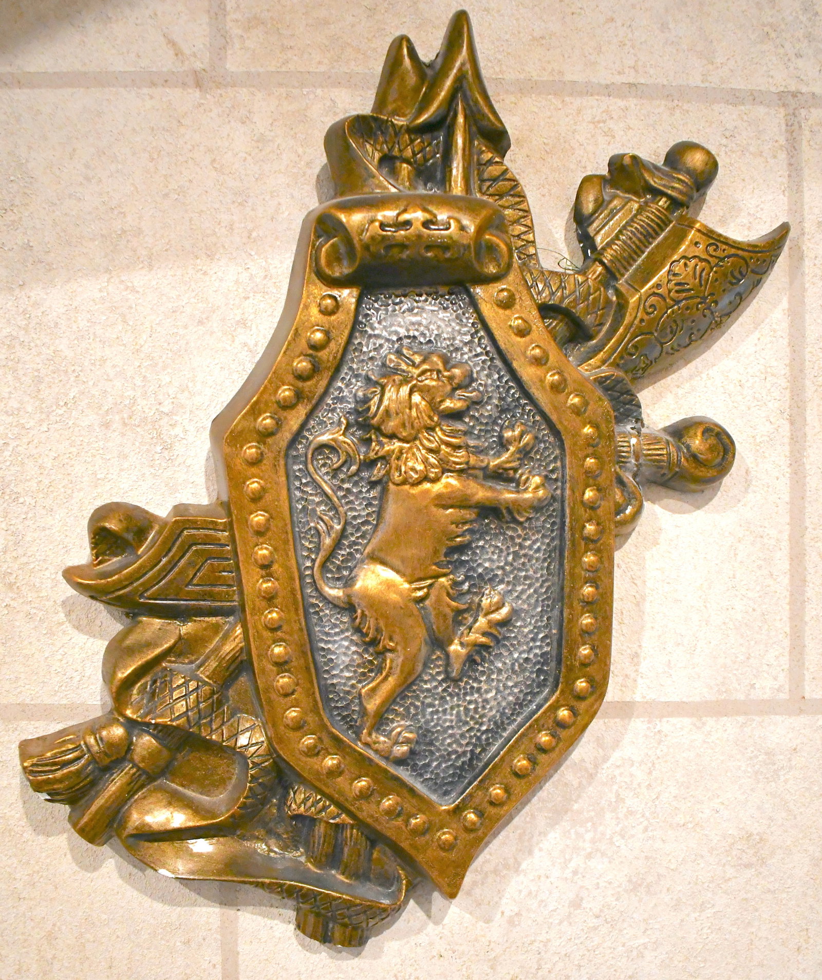 Contemporary Fiberglass / Plaster Bronze Crest: Includes Lion motif with ax and snake depicted on top