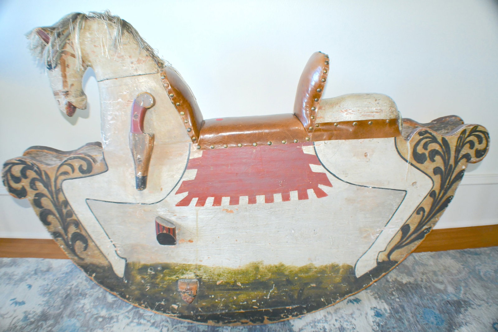 Old Swedish Type Folk Art Rocking Horse: Brown leather seat Brown and red color coloring on horse Threaded mane and tail 53" long x 16" wide x 33" tall