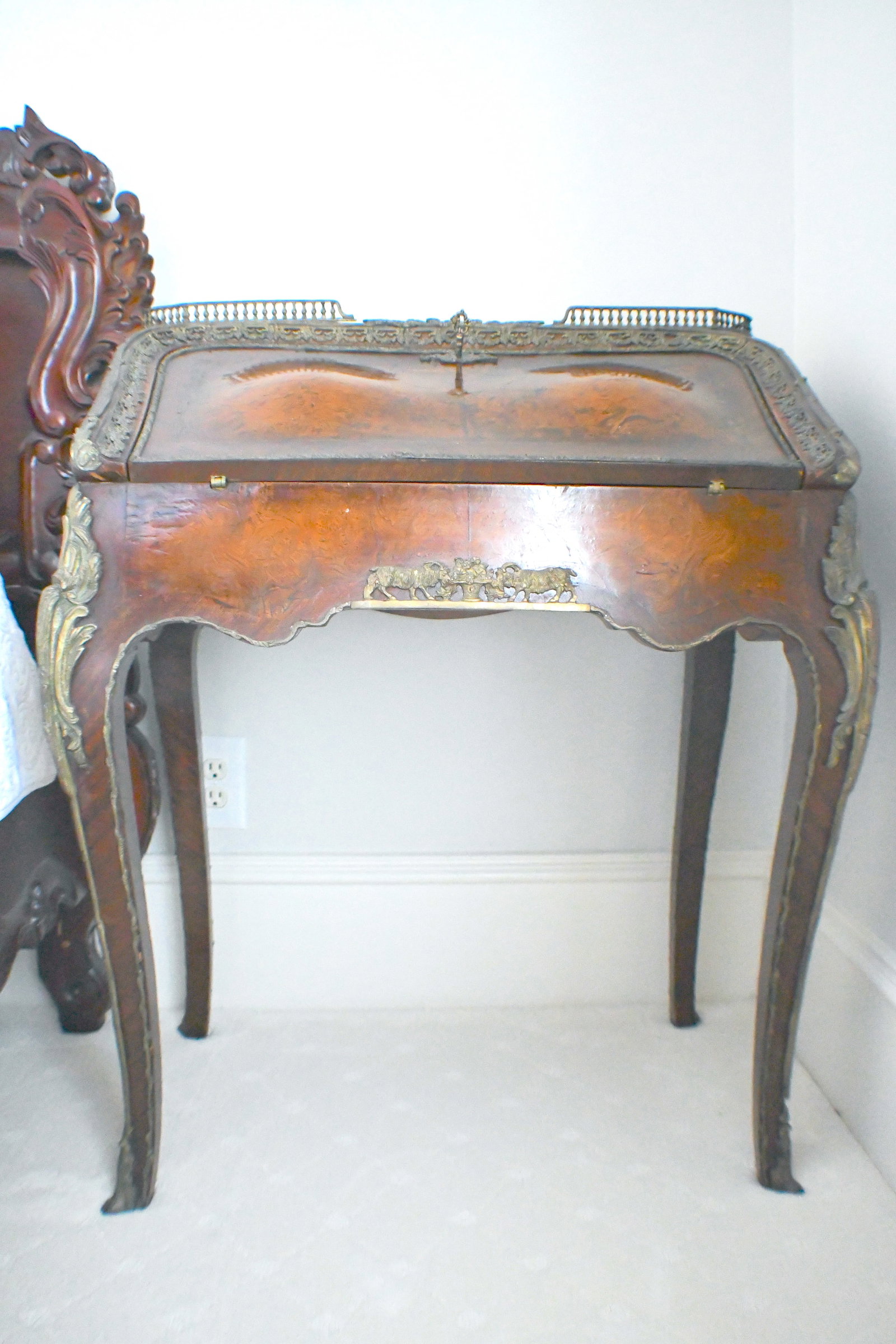 Secretary Desk: Top opens with green felt inside Three small drawers and a sliding bottom compartment Two Rams with fruit noted on front No markings or dates
