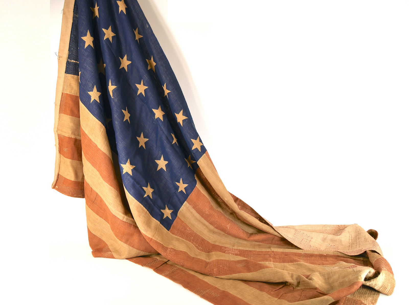 Beautiful Original Civil War Union 34-Star American Flag: Civil War Union 34-Star American Flag. Consists of 34 white stars in the upper left quadrant and 13 equally positioned stripes, 7 red and 6 white. Material appears to be linen sacking cloth. This flag