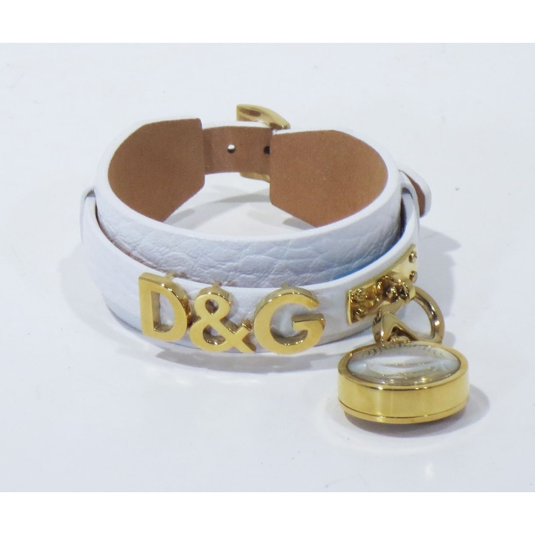 Dolce & Gabbana Bracelet with Clip-On Timepiece: A Dolce & Gabbana Leather Bracelet with Clip-On Timepiece, Having D&G logo letters and marked Dolce & Gabbana inside band. L: 8 1/4 in.