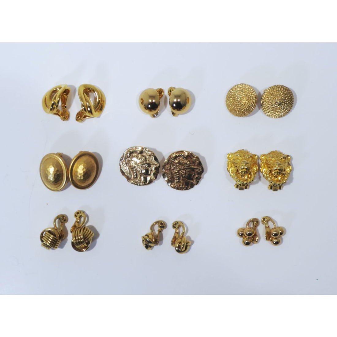 Nine Pairs of Gold Plated Vintage Clip-On Earrings: Nine Pairs of Gold Plated Vintage Clip-On Earrings, Seven marked Monet.