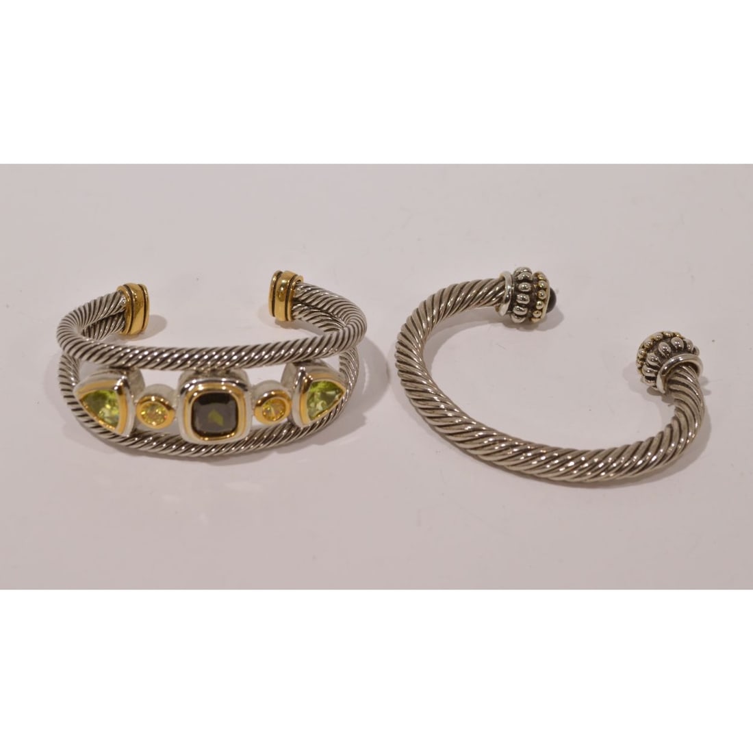 Two Twisted Cable Bracelets: Two Silver Plated Twisted Cable Bracelets, In the style of David Yurman. Diameter: 3 in.