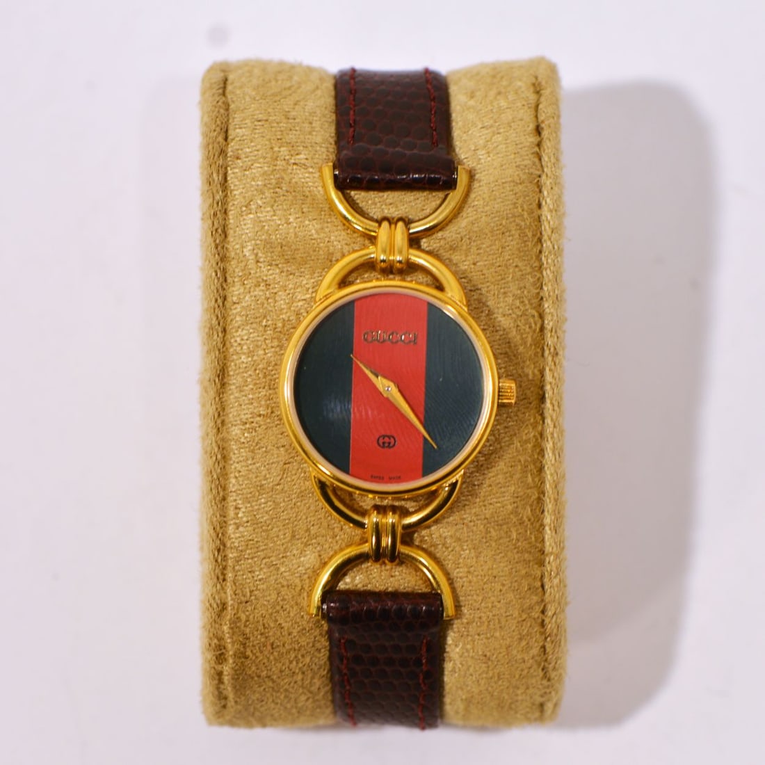 Vintage Gold Plated Gucci Watch with Leather Band: A Vintage Gold Plated Gucci Watch with Leather Band, Marked Gucci. L: 7 1/2 in.