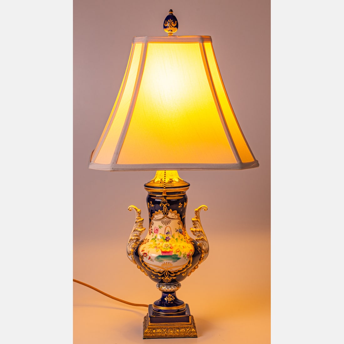 French Painted Porcelain Urn Mounted as a Lamp: A French Painted Porcelain Urn Mounted as a Lamp, 19th Century. H: 27 W: 7 D: 6 in.
