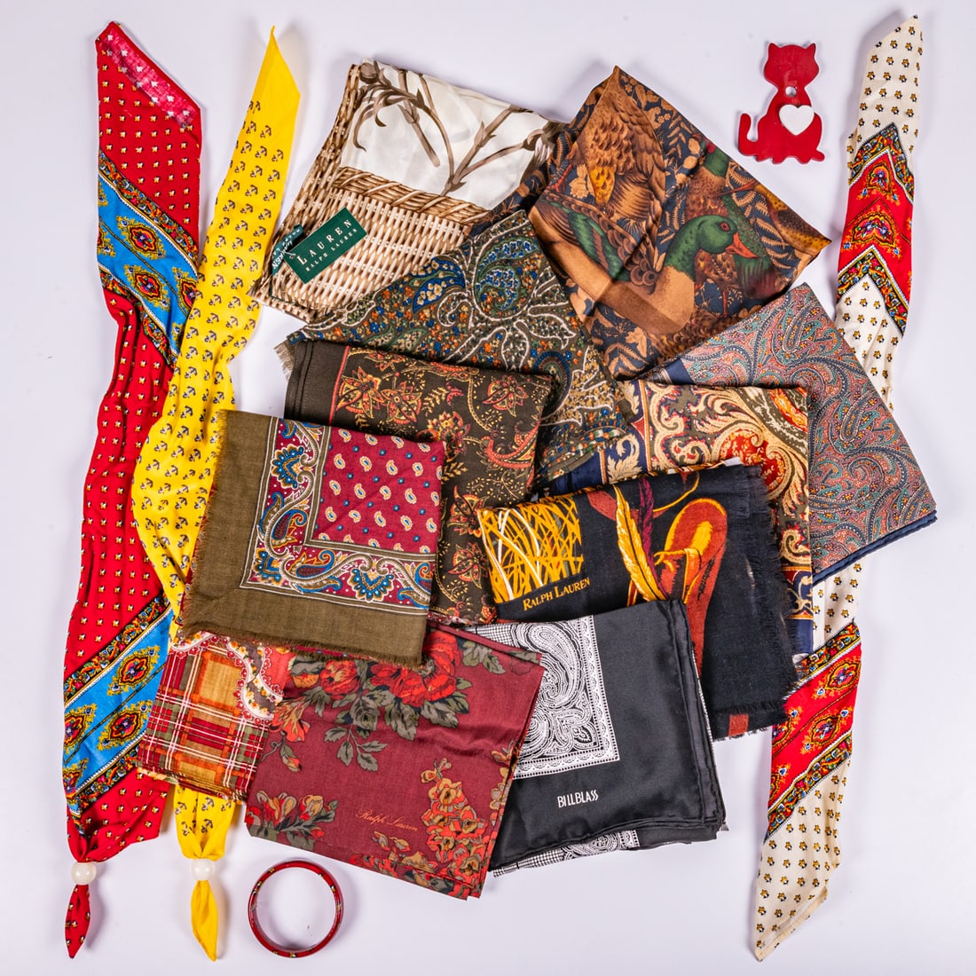 Collection of Scarves by Various Maker's: A Miscellaneous Collection of Silk and Cotton Scarves by Various Maker's, Including Ralph Lauren and Bill Blass.