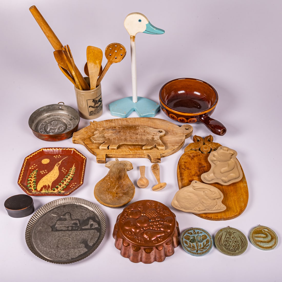 Collection of Vintage Kitchenware: A Miscellaneous Collection of Vintage Wooden, Ceramic, Metal and Wood Kitchenware, Including spoons, cutting boards, pie molds, paper towel holder. Longest dimensions: H: 17 1/4 x W: 8 1/2 in.
