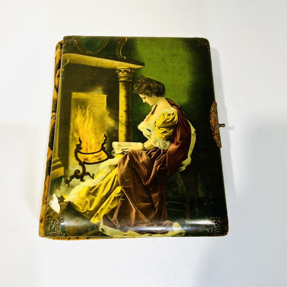Muller, Luchsinger & Co., N.Y. Printed Photo Album: A Muller, Luchsinger & Co., N.Y. Printed Photo Album with Photographs, Early 20th Century, With patterned velvet backing and metal details with photos in matte frames. Cover image depicting Victorian 