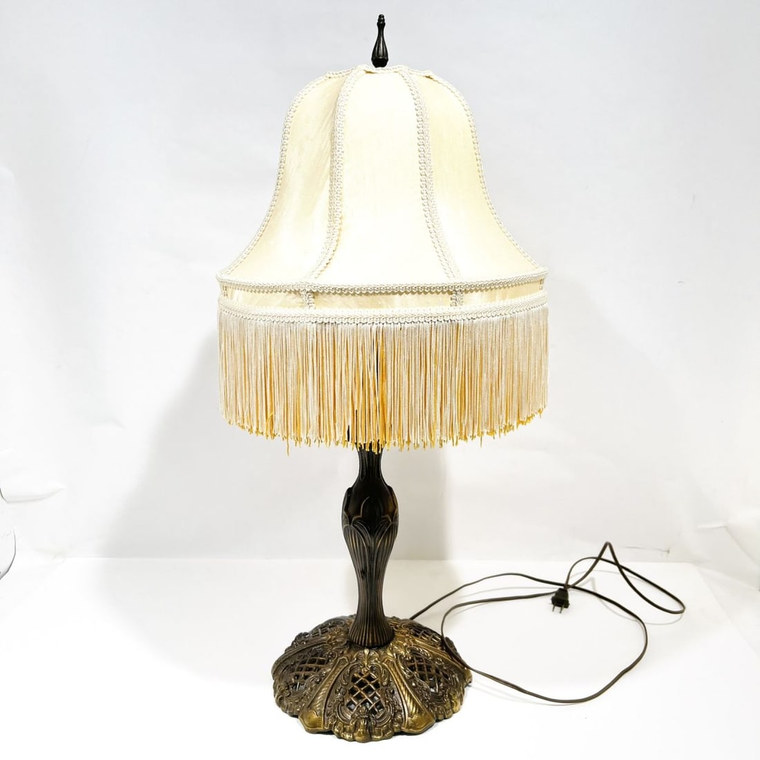Brass Art Nouveau Style Table Lamp: A Brass Art Nouveau Style Table Lamp, 20th Century, With a satin shade having fringe detail. H: 30 1/4 W: 9 in. From a private NE Ohio single-owner collection. Proceeds to benefit the Summit County Hu