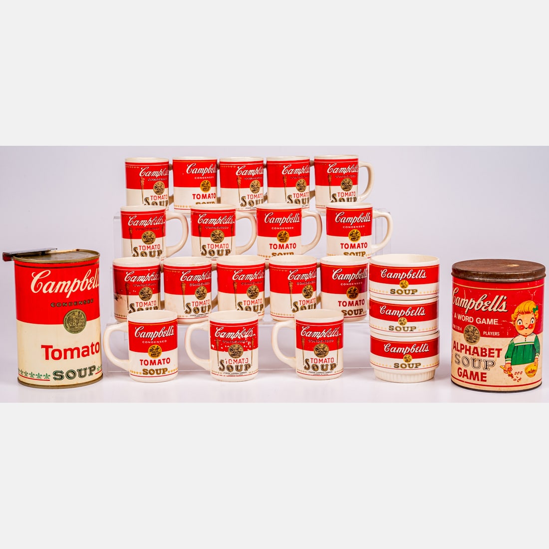 Campbell's Soup Mugs, Can Openers and Alphabet Soup Game: A Collection of Seventeen Campbell's Tomato Soup Mugs, Together with three wide mouth Campbell's Soup mugs, a Campbell's Tomato Soup can opener and an Alphabet Soup Word Game. Alphabet soup game dimen
