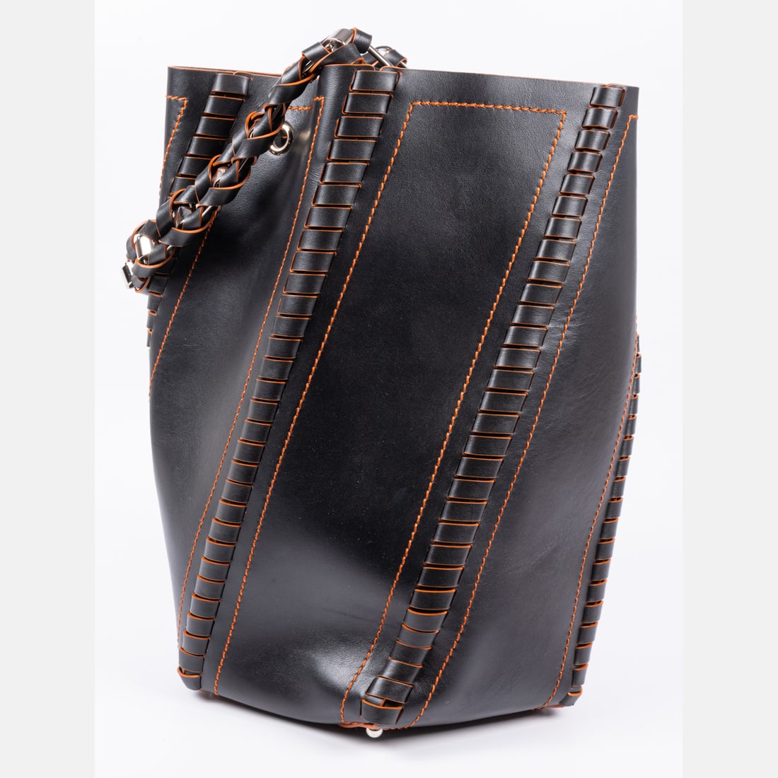 Proenza Schouler Hex Bucket Bag: A Proenza Schouler Hex Bucket Bag, Woven black leather with orange contrast stitching and metal hardware. Unlined. Secures via interior chain and toggle clasp. Measures H: 13 1/2 x W: 9 x D: 6. Drop f